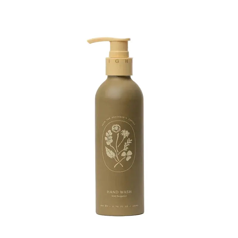 My Neighbor WILD BERGAMOT HAND WASH bottle, front, thoughtfully formulated to cleanse without stripping—using a base of organic olive oil, coconut oil, and aloe vera to nourish and hydrate the skin as you wash. WILD BERGAMOT scent.